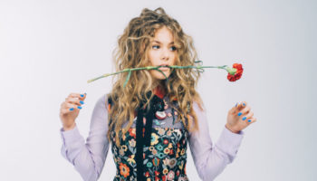 Kerri Medders holding a red carnation in mouth Red Valentino Dress Lot 17 Music